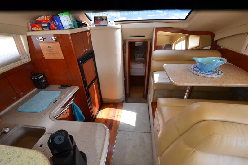 Slide: The Image of Interior of 2004 Sea Ray 480 Motor Yacht with kitchen and dining area. - 37