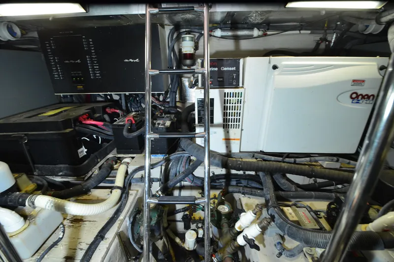Slide: The Image of Engine room of 2004 Sea Ray 480 Motor Yacht with Onan generator and wiring. - 46