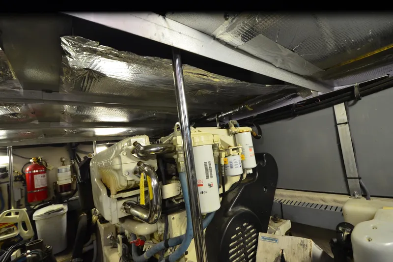 Slide: The Image of Engine room of a 2004 Sea Ray 480 Motor Yacht with visible machinery and equipment. - 53
