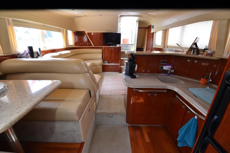 Slide: The Image of Luxurious interior of a 2004 Sea Ray 480 Motor Yacht with elegant seating and modern amenities. - 36