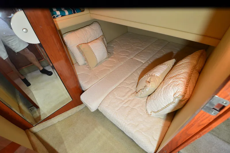 Slide: The Image of Luxurious cabin interior of 2004 Sea Ray 480 Motor Yacht with plush bedding. - 44