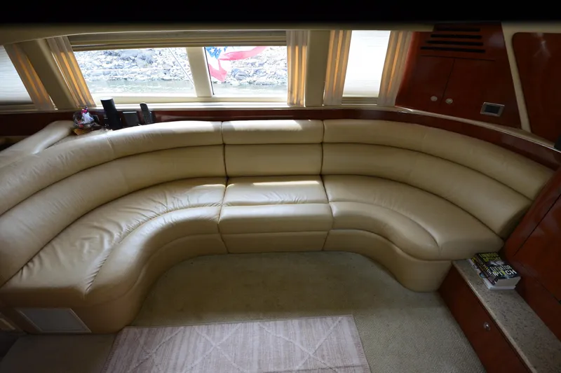 Slide: The Image of Luxurious interior of 2004 Sea Ray 480 Motor Yacht with curved leather seating. - 39