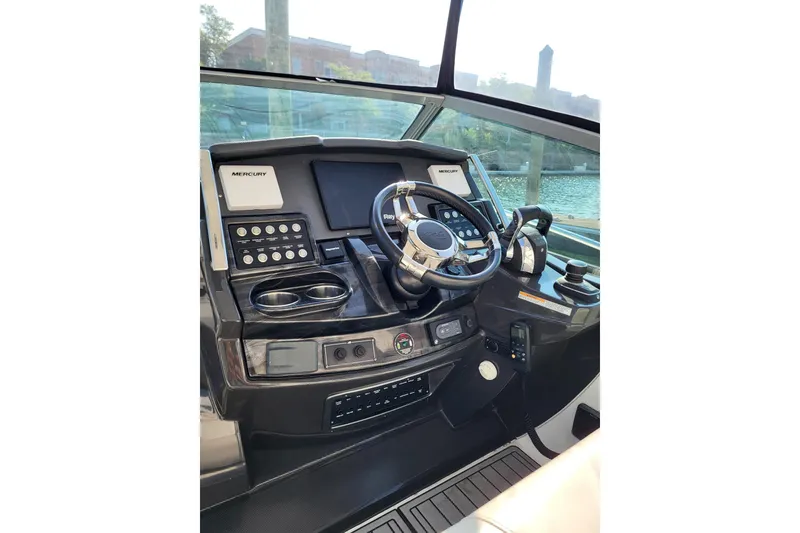 Slide: The Image of Helm of 2018 Monterey 335 Sport Yacht with advanced controls and navigation systems. - 4