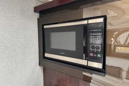 Slide: The Image of Built-in microwave in 2018 Monterey 335 Sport Yacht interior kitchen area. - 15