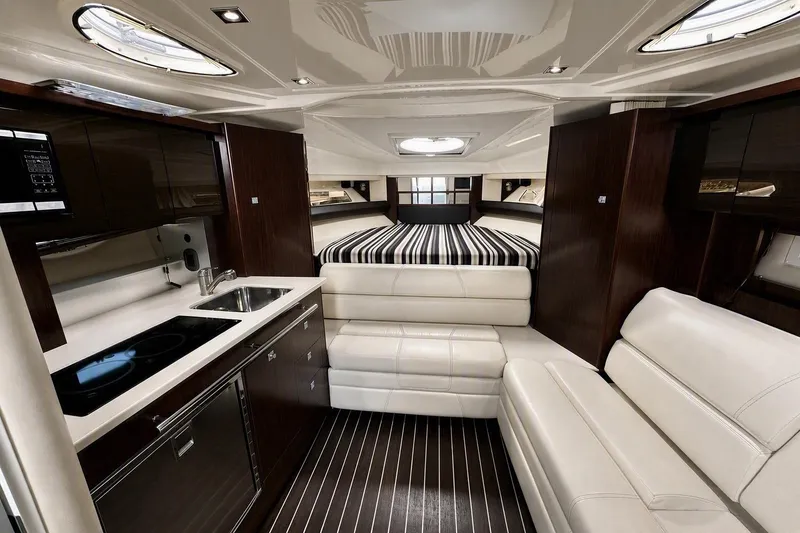 Slide: The Image of Luxurious interior of 2018 Monterey 335 Sport Yacht with modern kitchen and cozy seating. - 14