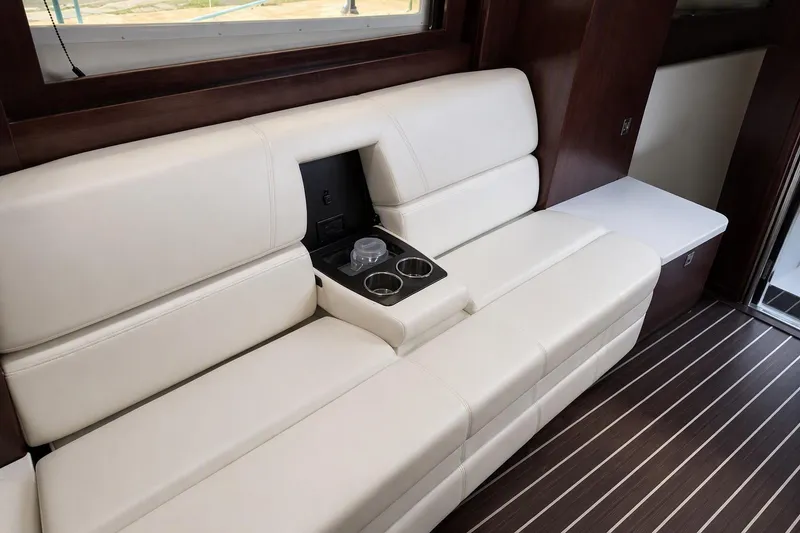 Slide: The Image of Luxurious interior seating of 2018 Monterey 335 Sport Yacht with cup holders. - 12