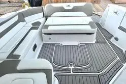 Slide: The Image of 2018 Monterey 335 Sport Yacht interior with cushioned seating and sleek flooring. - 9