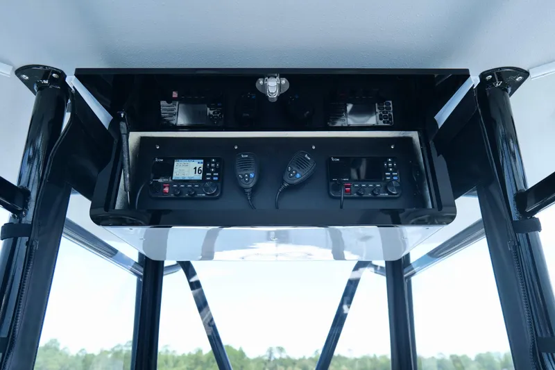 Slide: The Image of 2023 Andros 32 Offshore boat console with communication equipment and controls. - 13