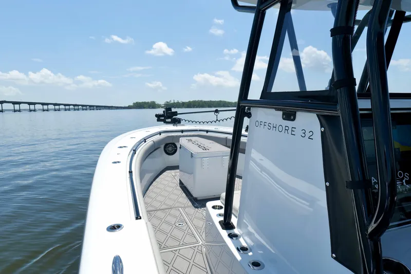 Slide: The Image of 2023 Andros 32 Offshore boat on calm water with clear sky. - 30