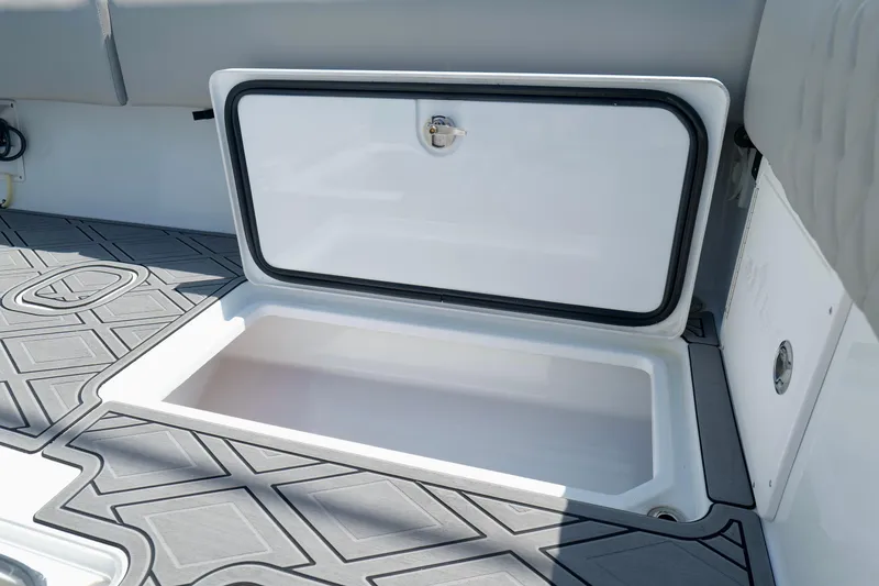 Slide: The Image of 2023 Andros 32 Offshore boat storage compartment with open hatch, featuring non-slip flooring. - 28