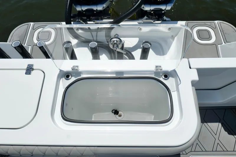 Slide: The Image of 2023 Andros 32 Offshore boat with open livewell and rod holders. - 21