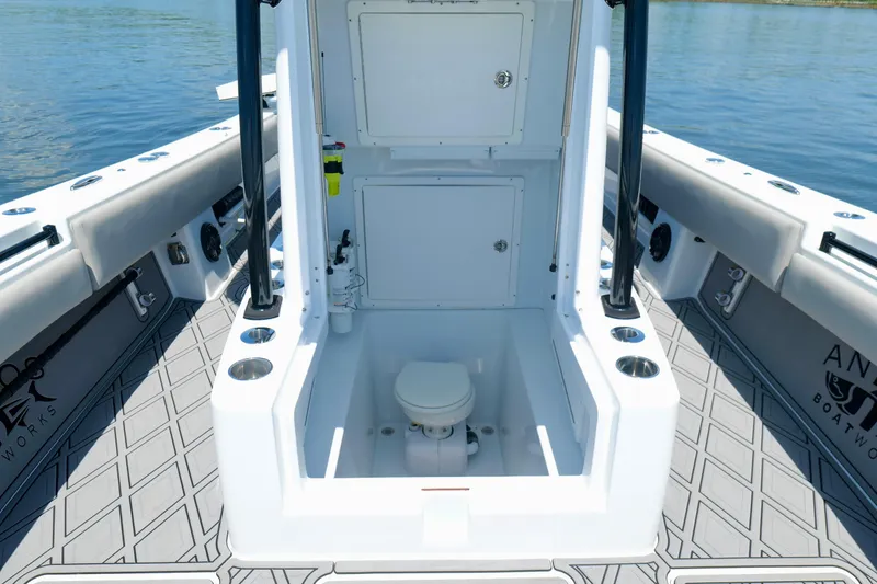 Slide: The Image of 2023 Andros 32 Offshore boat interior with marine toilet and storage compartments. - 35