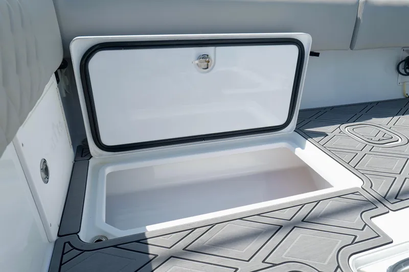 Slide: The Image of 2023 Andros 32 Offshore boat storage compartment with open hatch and patterned flooring. - 27