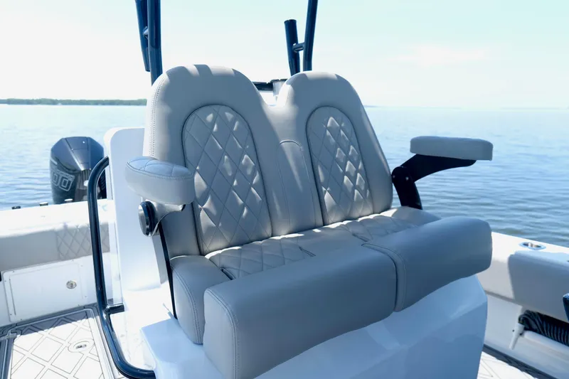 Slide: The Image of Luxurious seating on 2023 Andros 32 Offshore boat with diamond-stitched upholstery. - 15
