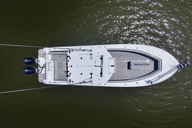 Slide: The Image of Aerial view of 2023 Andros 32 Offshore boat on water, showcasing deck layout and twin engines. - 43