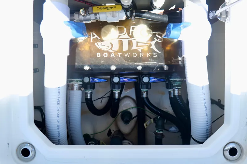 Slide: The Image of Andros 32 Offshore 2023 boat plumbing system with valves and hoses. - 29