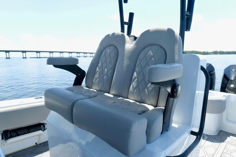 Slide: The Image of Luxury seating on 2023 Andros 32 Offshore boat with diamond-stitched upholstery. - 16