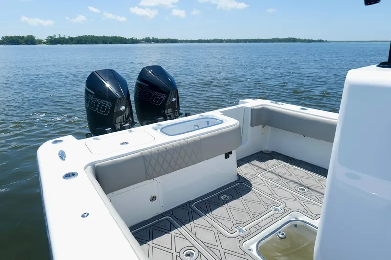 Slide: The Image of 2023 Andros 32 Offshore boat with twin engines on a calm lake. - 18