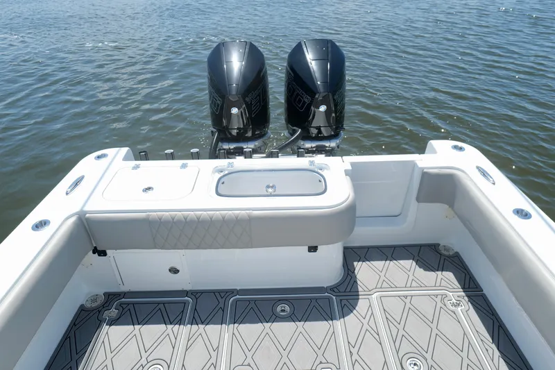 Slide: The Image of 2023 Andros 32 Offshore boat with dual engines and spacious deck on water. - 19