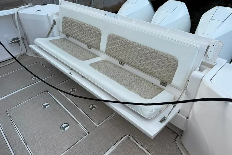 Slide: The Image of 2021 Intrepid 477 Evolution boat with foldable seating and textured upholstery. - 6