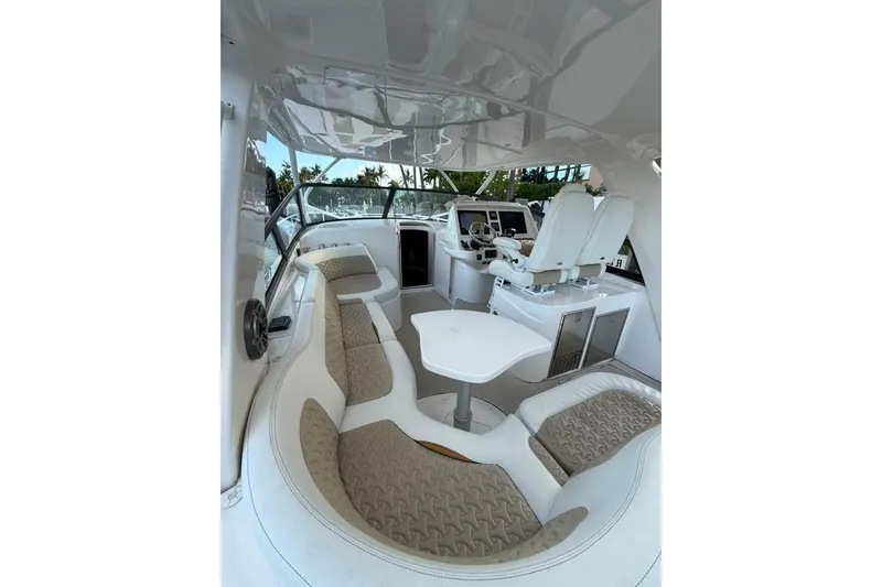 Slide: The Image of Interior of 2021 Intrepid 477 Evolution yacht with plush seating and modern helm. - 7