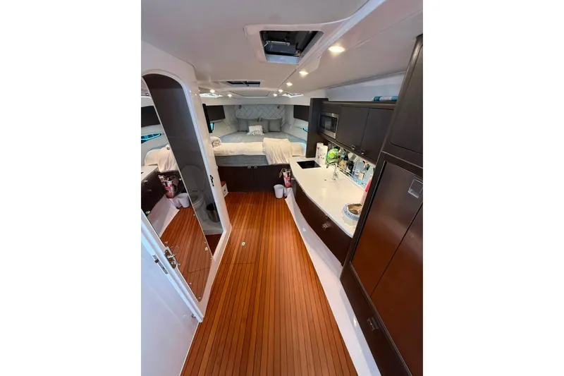 Slide: The Image of Luxurious interior of 2021 Intrepid 477 Evolution yacht with wood flooring and modern amenities. - 10