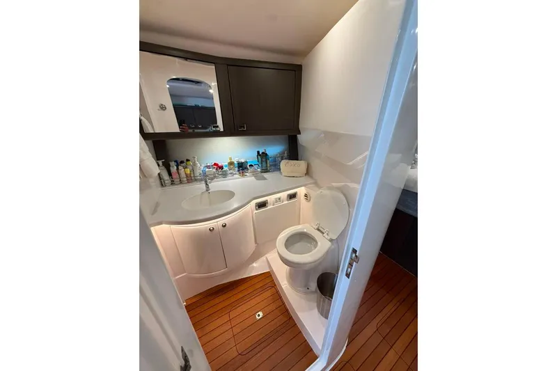 Slide: The Image of Luxurious bathroom in 2021 Intrepid 477 Evolution yacht with modern fixtures and wooden flooring. - 12