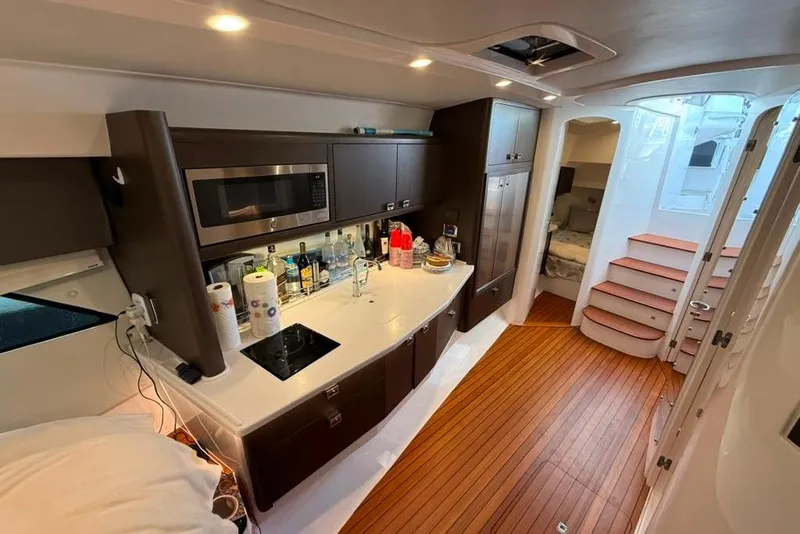 Slide: The Image of Luxurious interior of 2021 Intrepid 477 Evolution yacht with modern kitchen amenities. - 15