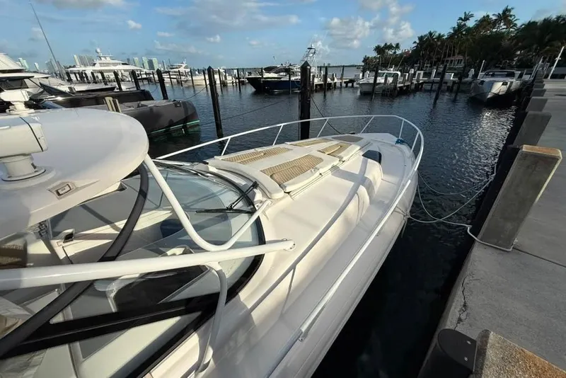 Slide: The Image of Intrepid 477 Evolution 2021 docked at marina with clear skies and calm waters. - 17