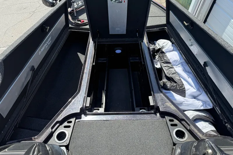 Slide: The Image of 2021 Nitro Z20 boat interior with open storage compartments and visible Mercury branding. - 94