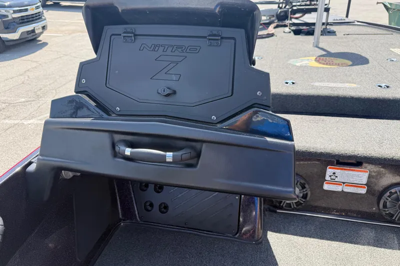 Slide: The Image of 2021 Nitro Z20 boat storage compartment with open lid, showcasing interior details. - 95