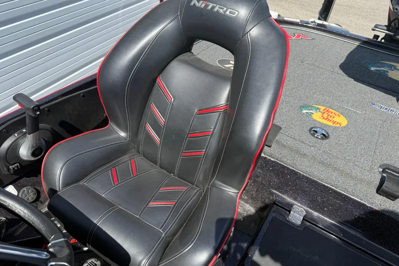 Slide: The Image of Black and red seat in a 2021 Nitro Z20 boat, featuring sleek design and branding. - 102