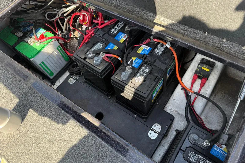 Slide: The Image of Battery compartment of a 2021 Nitro Z20 boat, featuring multiple deep cycle batteries. - 106