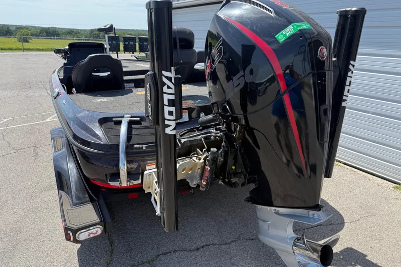 Slide: The Image of 2021 Nitro Z20 boat with powerful engine and Talon anchoring system in a parking area. - 83