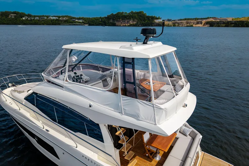 Slide: The Image of Luxurious 2025 Pacific Prestige 460 Fly yacht cruising on serene waters. - 10