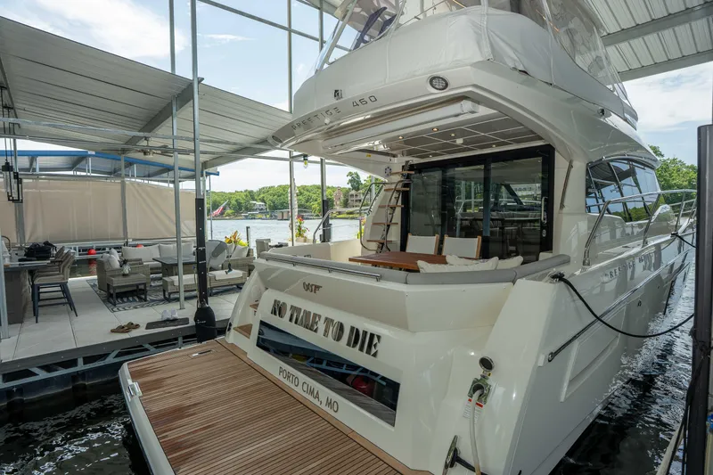 Slide: The Image of Luxury yacht Pacific Prestige 460 Fly, 2025 model, docked at a marina. - 30