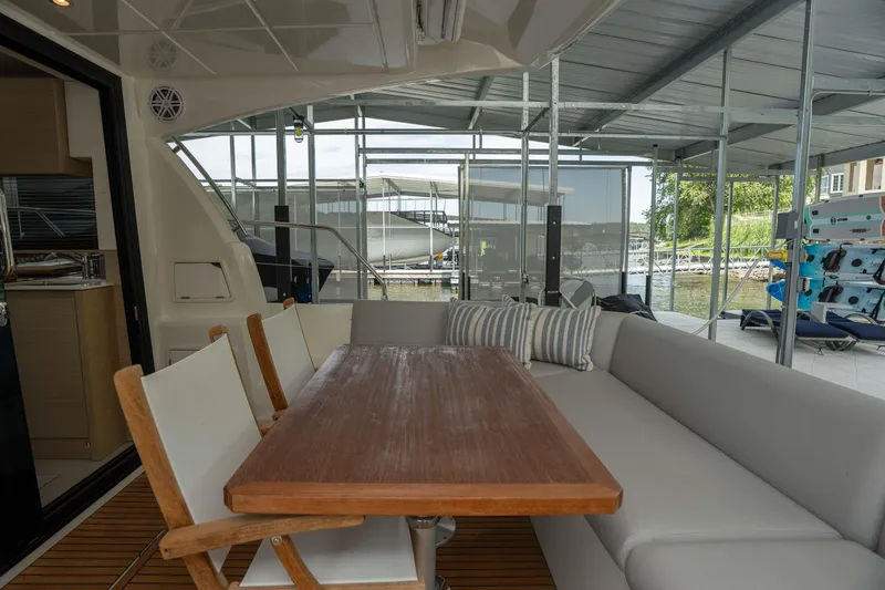 Slide: The Image of Luxurious 2025 Pacific Prestige 460 Fly yacht interior with elegant dining area and comfortable seating. - 26