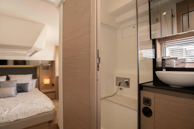 Slide: The Image of Luxurious interior of 2025 Pacific Prestige 460 Fly yacht with modern bedroom and bathroom. - 36
