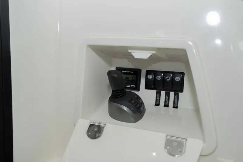 Slide: The Image of Control panel of 2025 Pacific Prestige 460 Fly yacht with joystick and switches. - 21