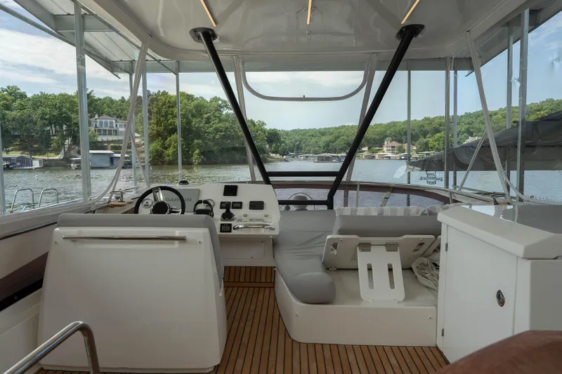 Slide: The Image of Interior view of 2025 Pacific Prestige 460 Fly yacht with scenic lake backdrop. - 28