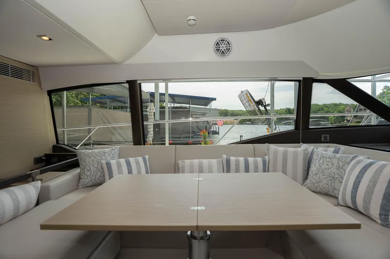Slide: The Image of Luxurious interior of 2025 Pacific Prestige 460 Fly yacht with elegant seating and table. - 46