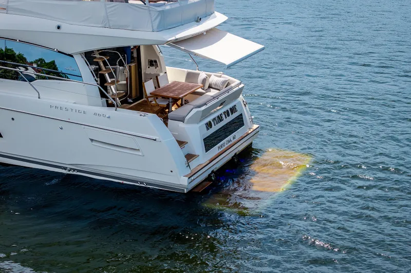 Slide: The Image of Luxury yacht Pacific Prestige 460 fly, 2025 model, cruising on serene waters. - 13
