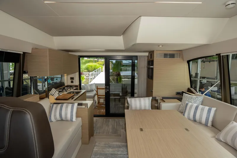 Slide: The Image of Luxurious interior of 2025 Pacific Prestige 460 Fly yacht with modern furnishings and large windows. - 54