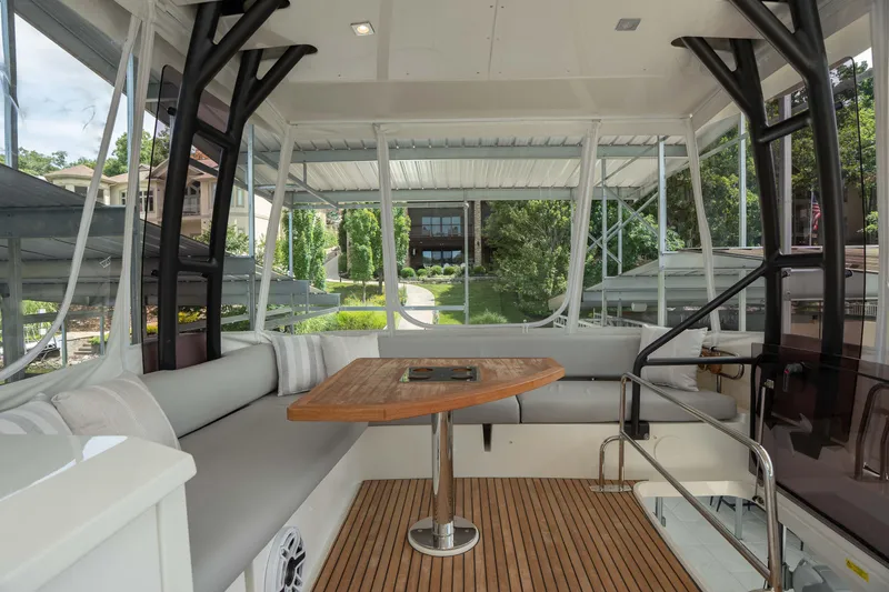 Slide: The Image of Luxurious interior of 2025 Pacific Prestige 460 Fly yacht with elegant seating and wooden table. - 31