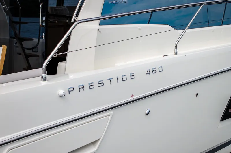 Slide: The Image of 2025 Pacific Prestige 460 Fly yacht, sleek design with modern railings and branding. - 25