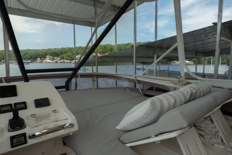 Slide: The Image of Luxurious 2025 Pacific Prestige 460 Fly yacht interior with scenic waterfront view. - 27