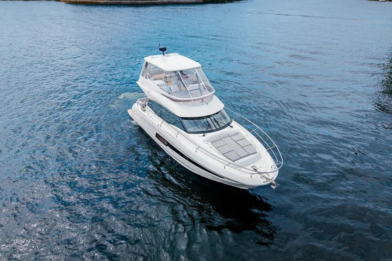 Slide: The Image of 2025 Pacific Prestige 460 Fly yacht cruising on open water. - 7