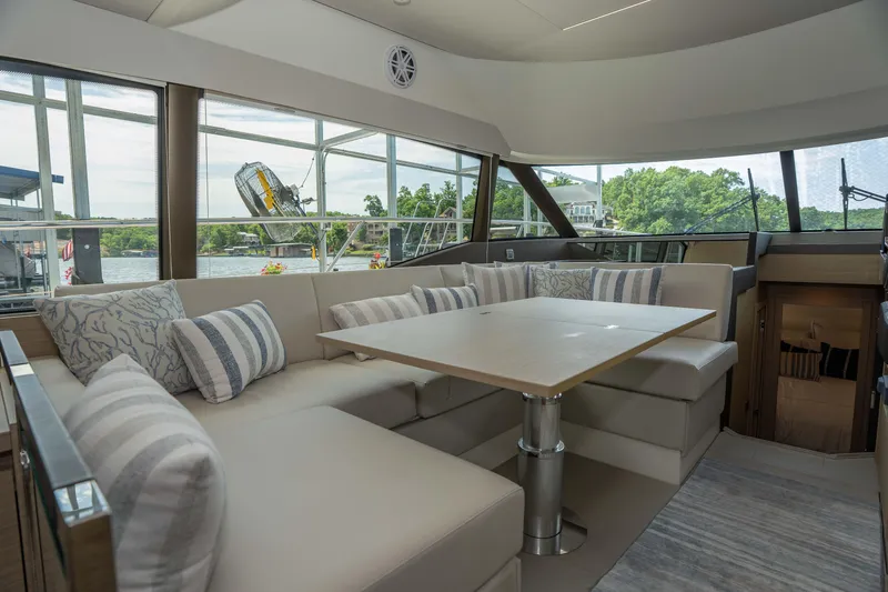 Slide: The Image of Luxurious interior of 2025 Pacific Prestige 460 Fly yacht with elegant seating and scenic views. - 49