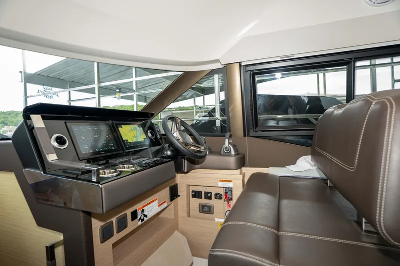 Slide: The Image of Interior cockpit of 2025 Pacific Prestige 460 Fly yacht with modern navigation system. - 55