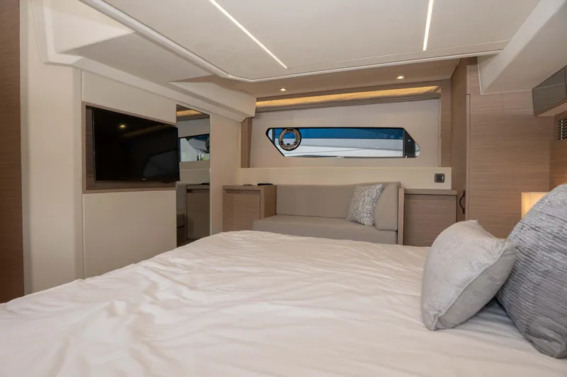 Slide: The Image of Luxurious interior of 2025 Pacific Prestige 460 Fly yacht with modern design and cozy bedding. - 37